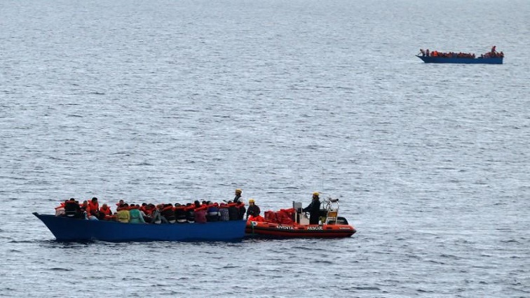 In the Mediterranean Sea near the coast of Libya, German NGO Jugend Rettet's ship "Juventa" crew rescues migrants aboard a wooden boat.