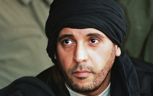 Hannibal Gaddafi observes elite military training in Zlitan, Libya, amidst political unrest.