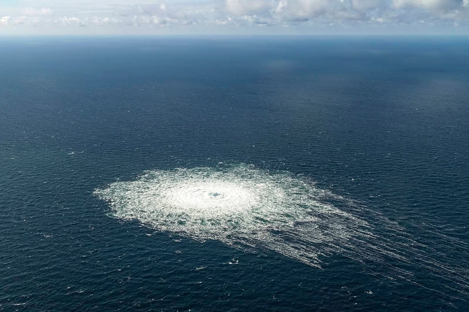 Danish Military's September 2022 image reveals Nord Stream 2 gas leak with bubbles resurfacing in Baltic Sea near Bornholm Island.