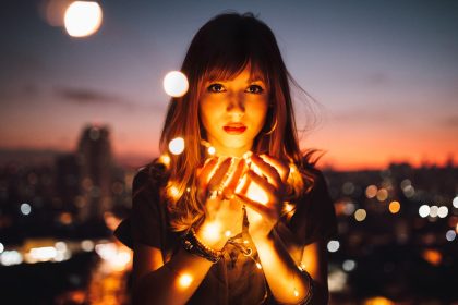 Wisdom Woman Holding Fireflies