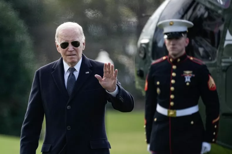 President Joe Biden bids farewell, waving as he exits Marine One upon his return to the White House on December 19, 2023, in Washington, D.C. In a statement dated December 29, 2023, Biden cautioned about the potential for the United States to become entangled in a direct conflict with Russia should Moscow achieve success in the Ukraine war.