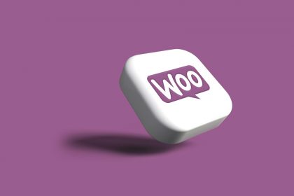 WooCommerce a purple and white square with the word woo on it