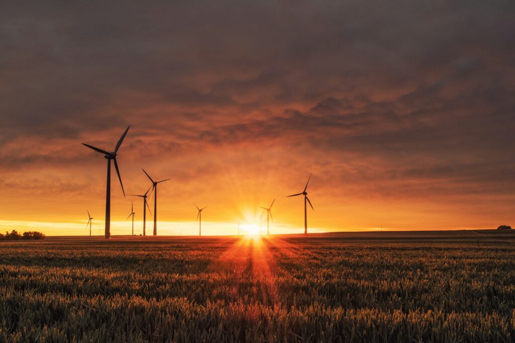 windmill on grass field during golden hour Environmental Concerns Underground Cities