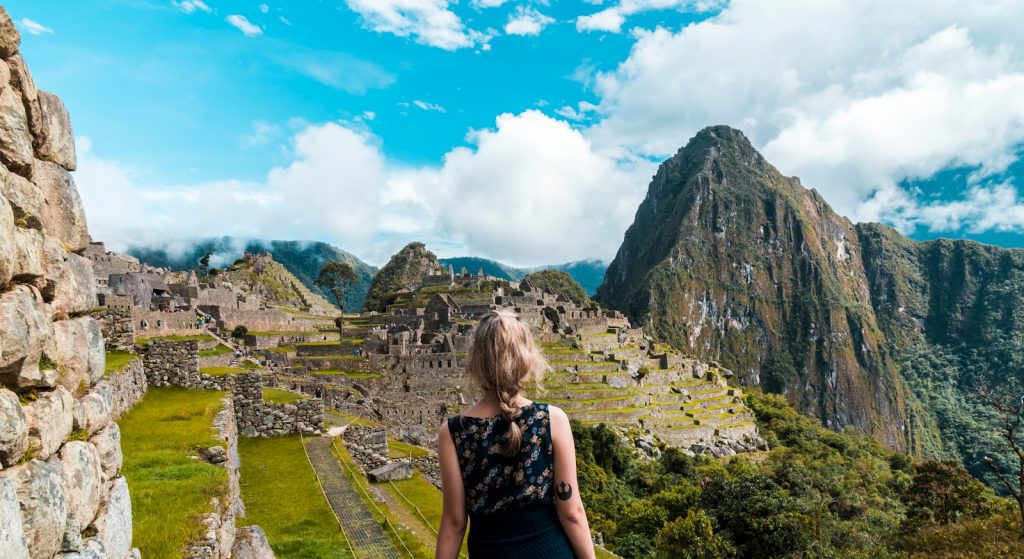 woman facing Machu Picchu Machu Picchu  Unveiling the Mysteries