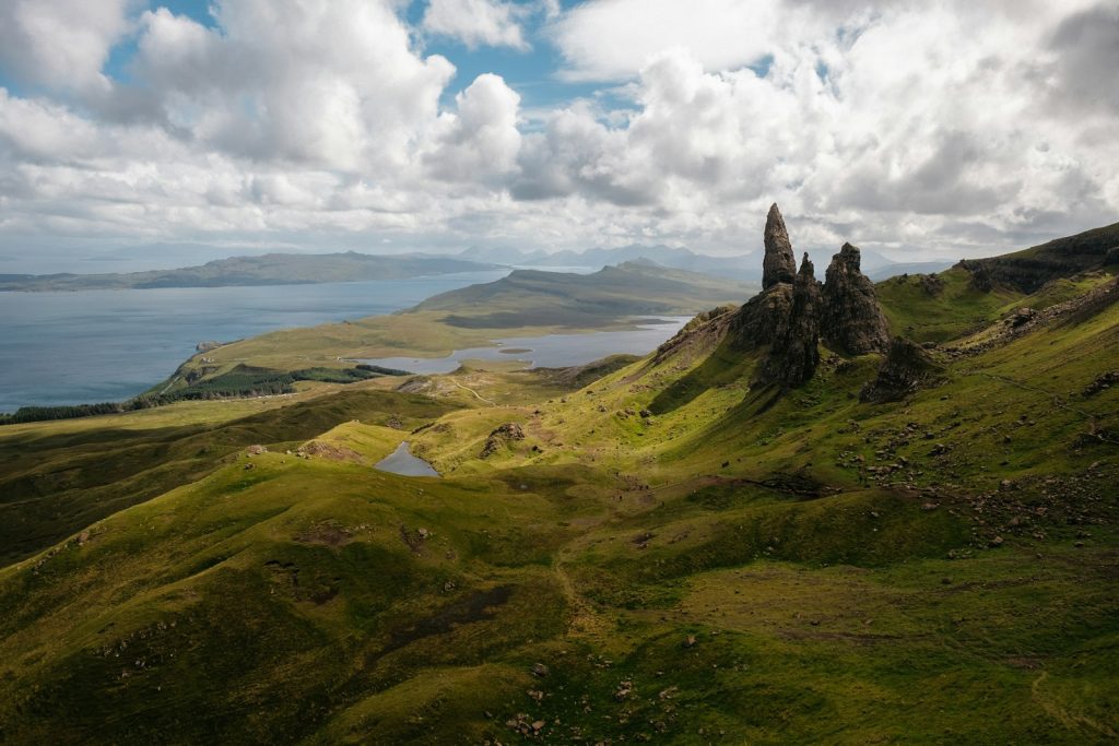 panoramic photography of hills on planes during daytime The Isle of Skye Into the Wild