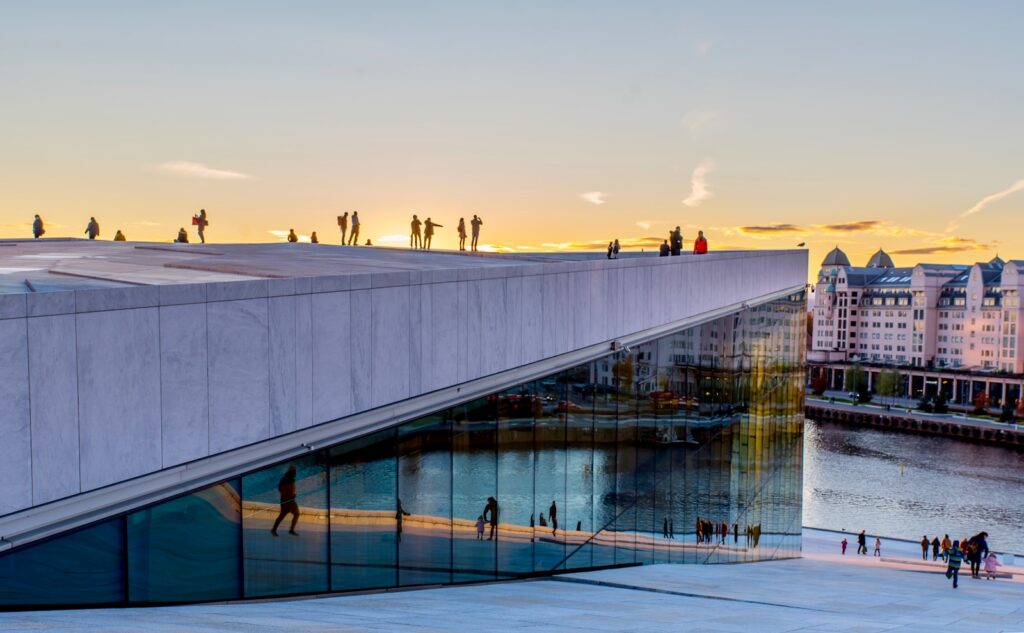 group of people on top of building Oslo Norwegian Odyssey