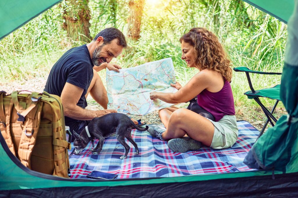 man in blue crew neck t-shirt and brown shorts sitting on blue and white textile Golden Age of Travel Luxury Train Journeys