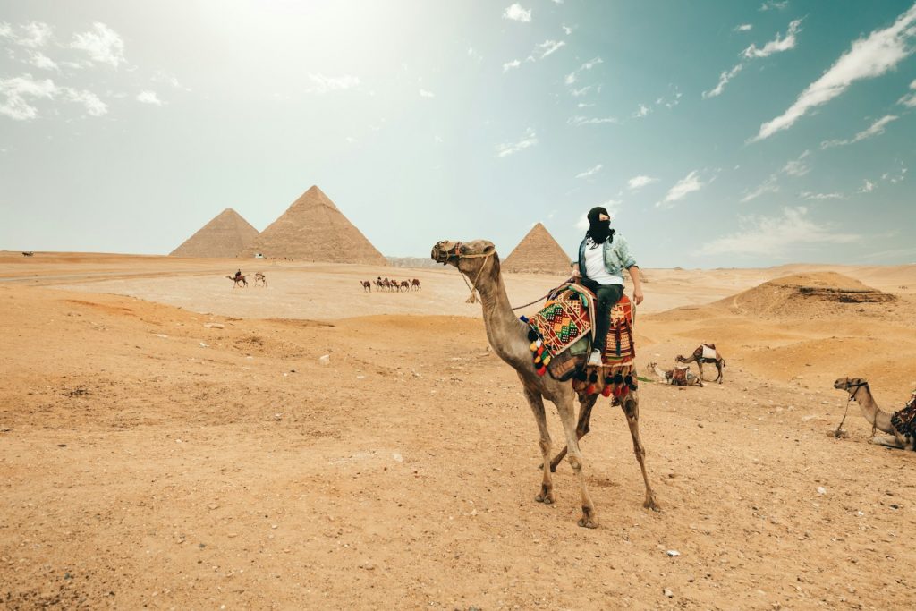 man riding camel  Egypt. Journey Through Time
