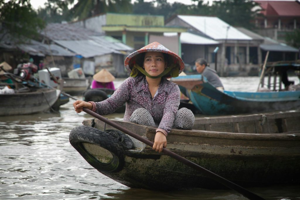 woman paddling on boat Cultural Immersion
