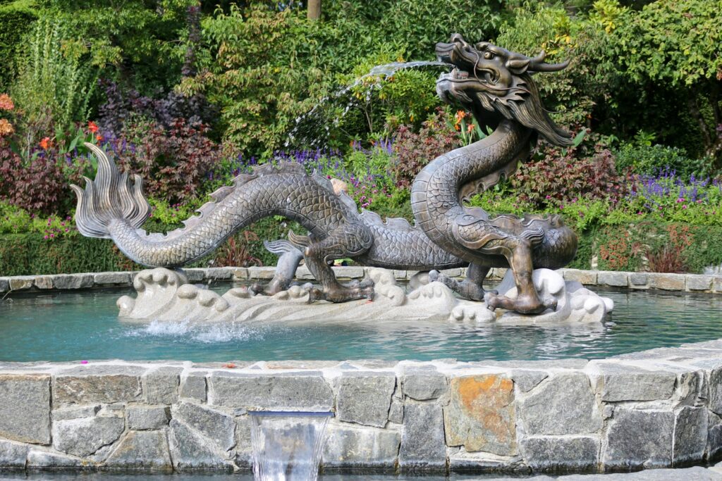 grey dragon water fountain Butchart Gardens Famous Gardens and Parks