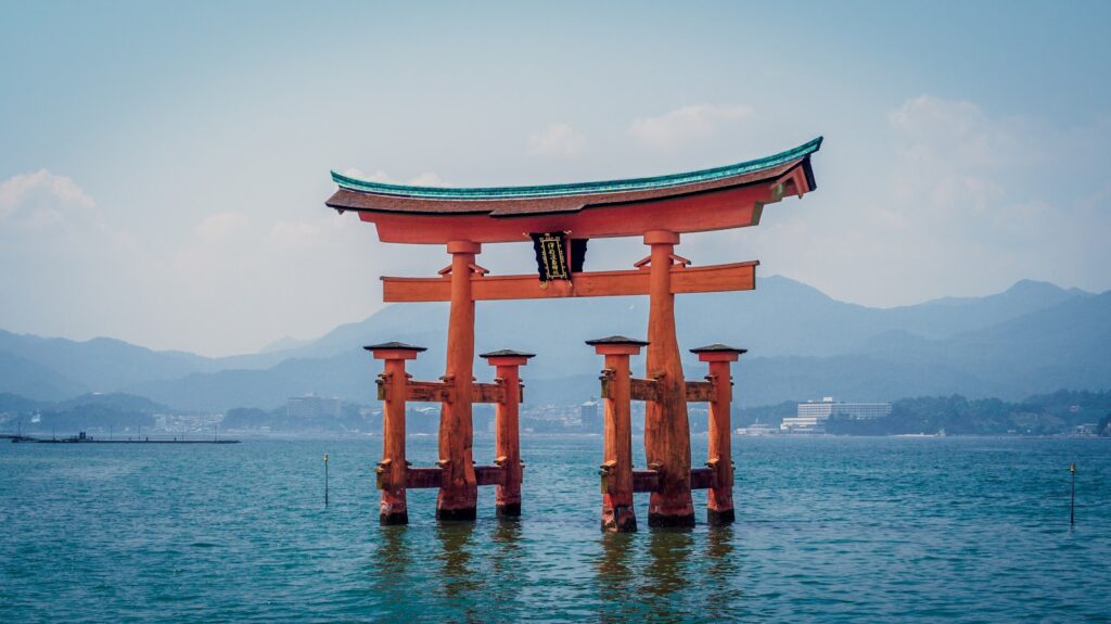 red shrine in body of water Contemplating Hiroshima and Nagasaki Battlegrounds and War