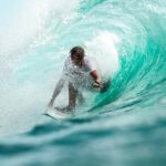 time lapse photography surfer in wave water