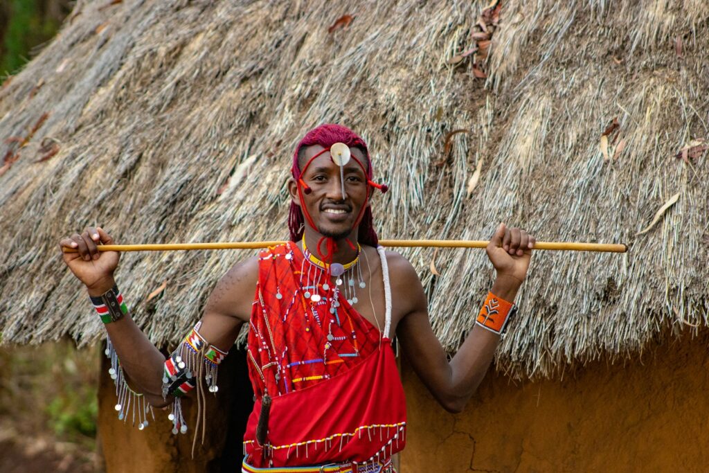 a man with a stick in his hand Exploring 7 Unique Traditions Across Africa
