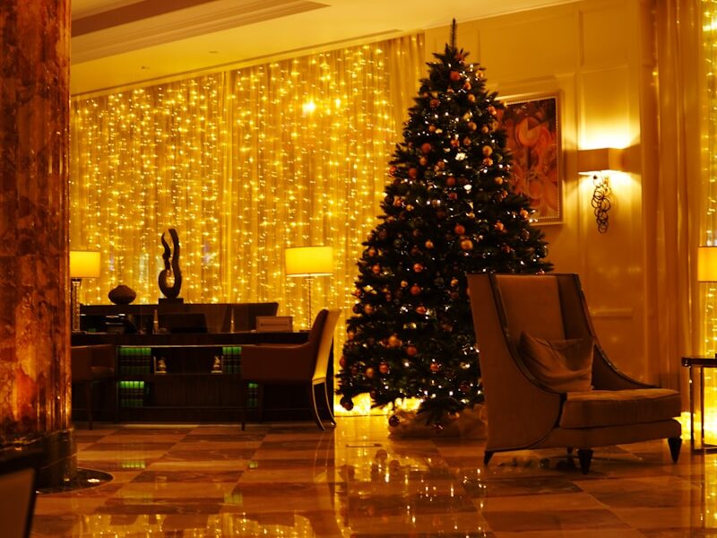 a christmas tree in the middle of a hotel lobby Immersed in Tradition