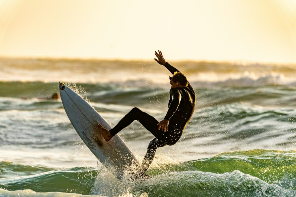 shallow focus photography of man surfing Outdoor Adventure Sports Outdoor Adventure Sports