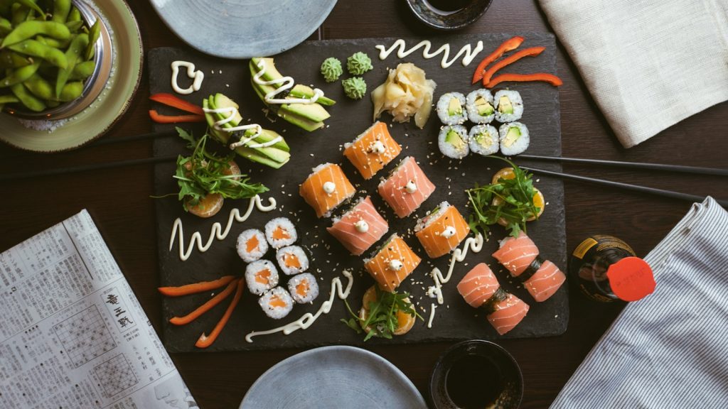 sushi on black ceramic plate The Cultural Tapestry of Cuisine A Gastronomic Journey
