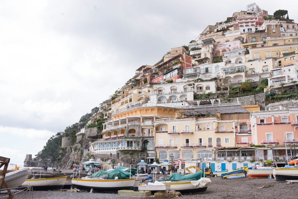 assorted sail boats on seashore during daytime The Amalfi Coast Exploring the Open Road