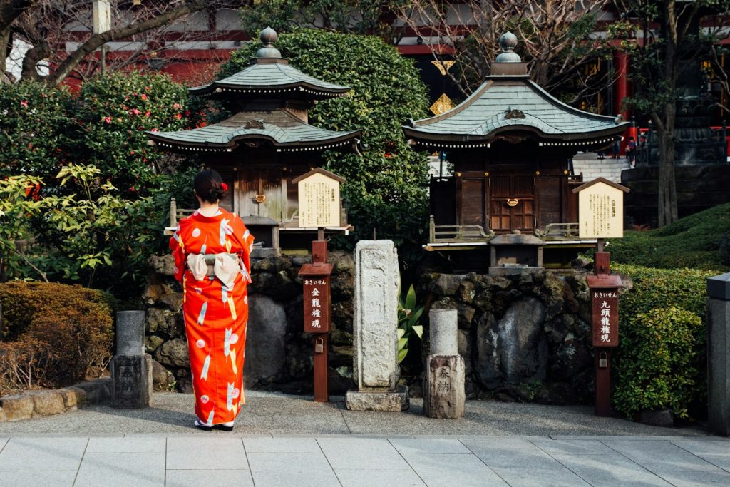 woman standing near building at daytime Cultural Immersion in Japan Exploring the World