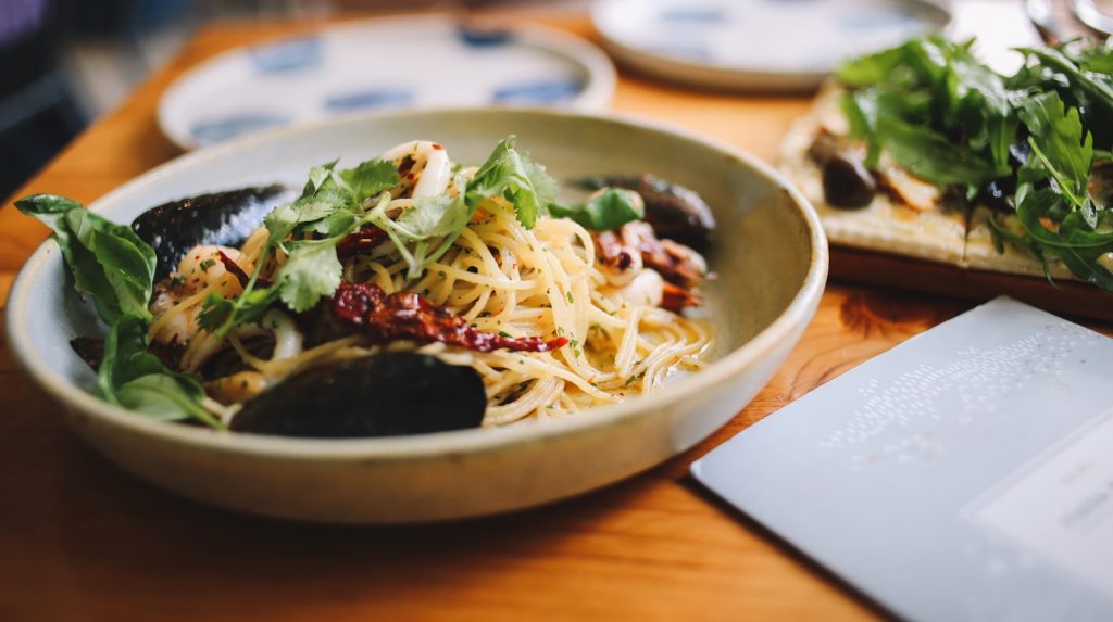 pasta with sauce on plate Culinary Innovation  A Gastronomic Journey