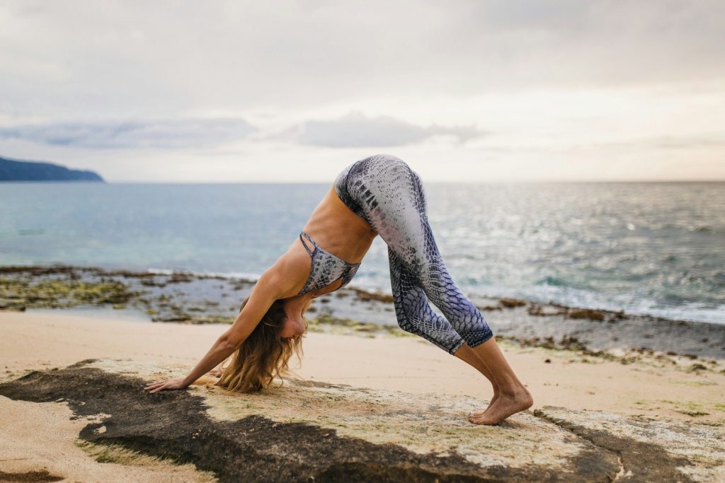 woman doing yoga pose Yoga and Meditation Retreats Enhancing Wellness