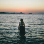 woman walking on body of water