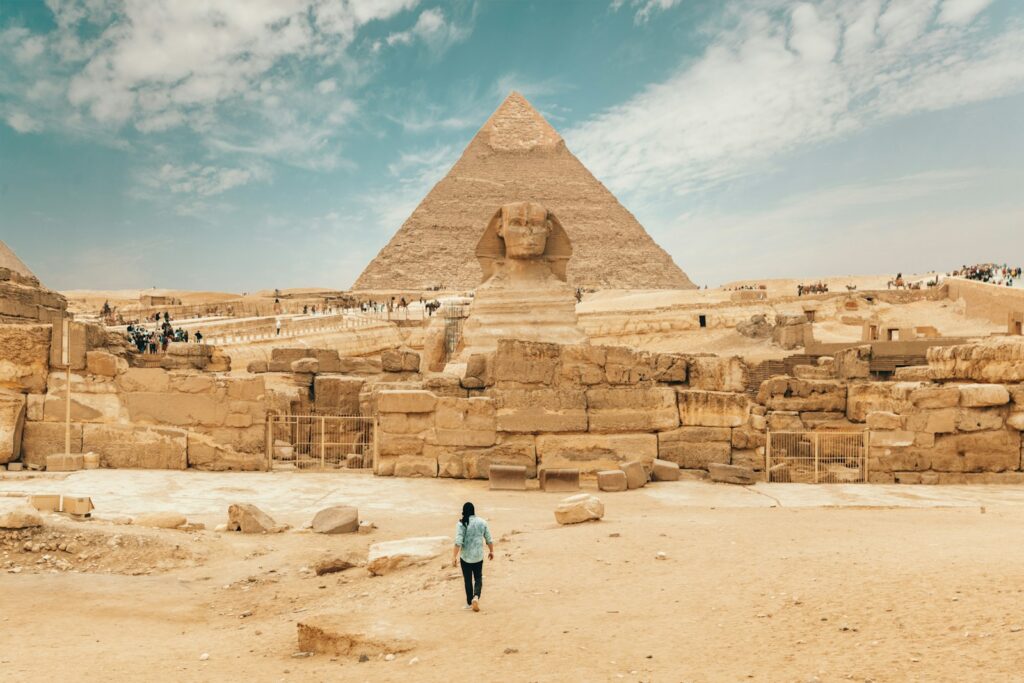 person walking near The Great Sphinx Egypt Mysteries of Ancient Civilizations