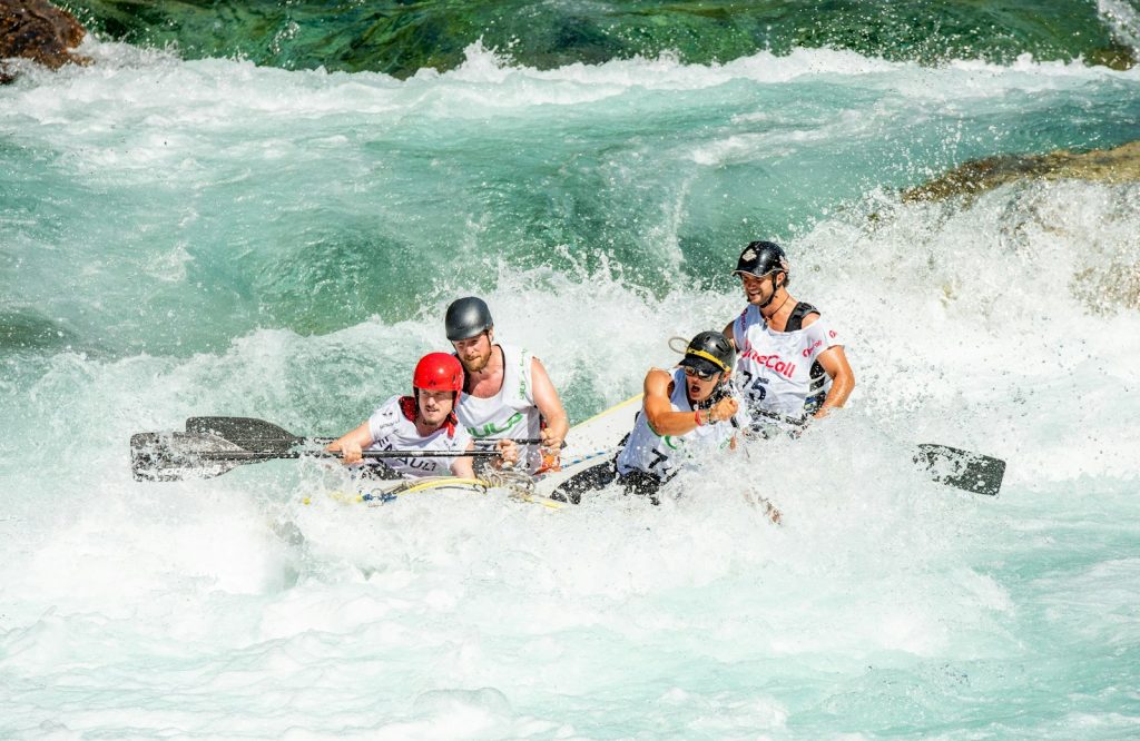 group of people kayaking on body of water Whitewater Rafting Embrace the Thrill