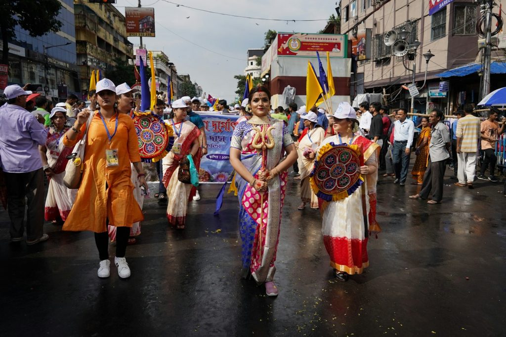 a group of people that are walking in the street cultural pride Embracing Culture