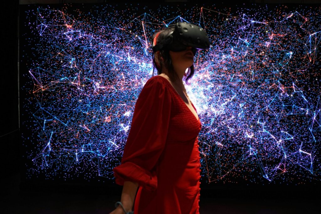 a woman in a red dress wearing a virtual reality headset Prime Gaming