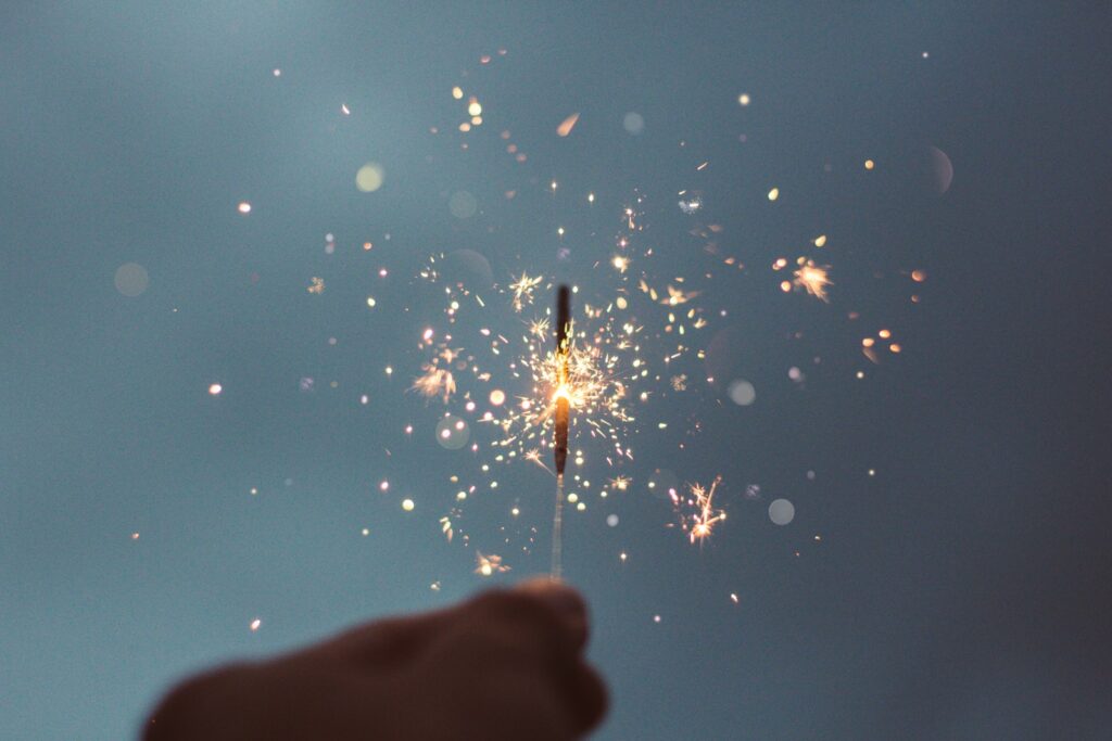 person holding lighted sparklers Legacy of Magic Magic Online