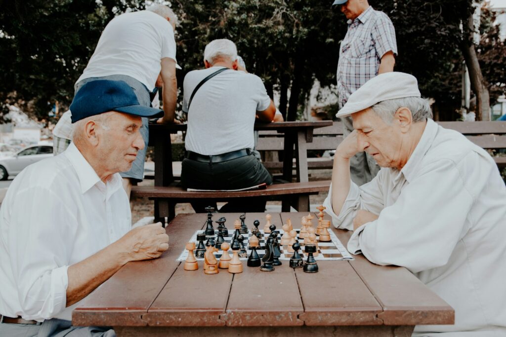 two men playing chess Social Gaming Wide World of Game Poki