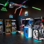 a room filled with arcade machines and neon lights