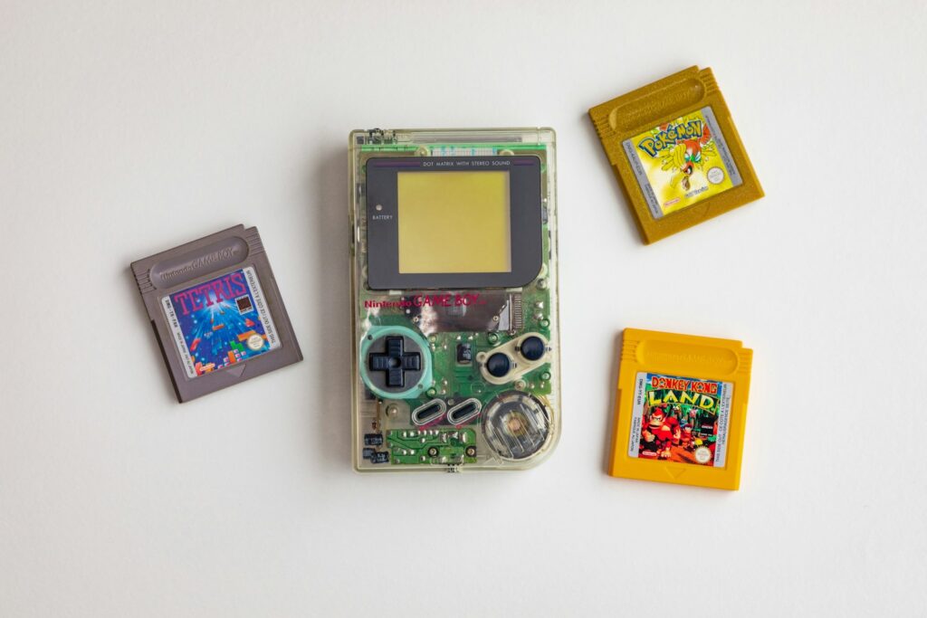 clear and green Nintendo GameBoy on white surface Nostalgia Nostalgia Alert