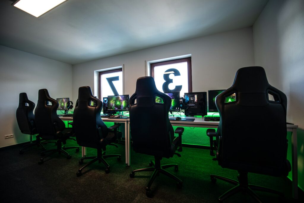 black office rolling chair near black flat screen computer monitor Getting Started with Prime Gaming