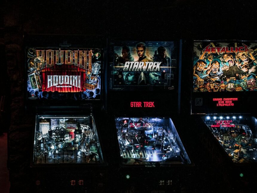 a row of pinball machines sitting next to each other