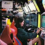 woman driving arcade machine