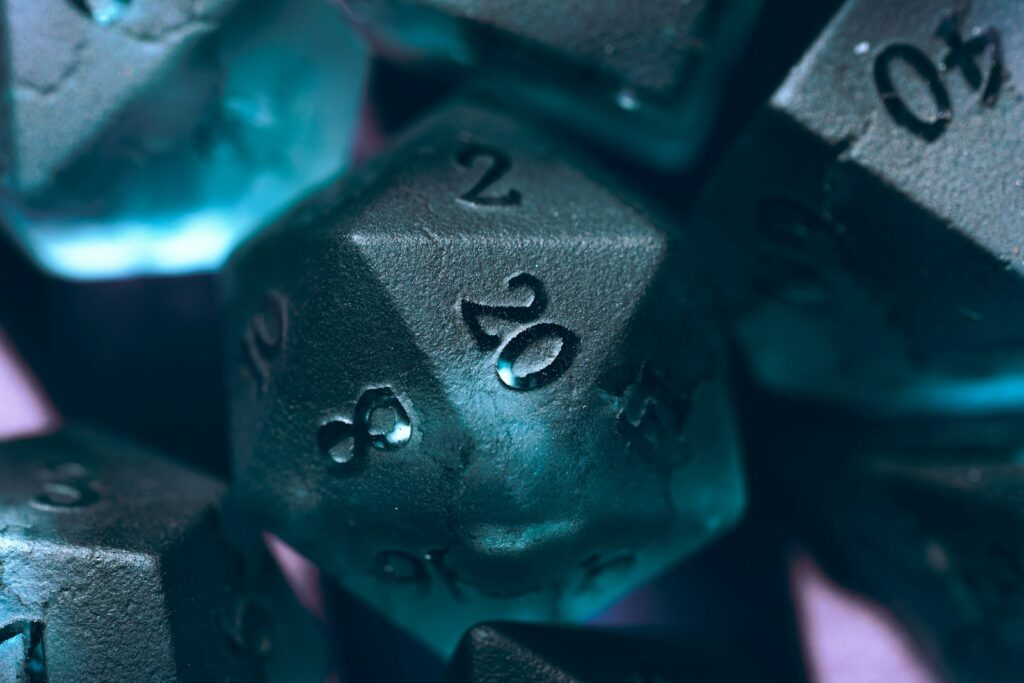 a close up of a metal dice with numbers on it Earn to Die