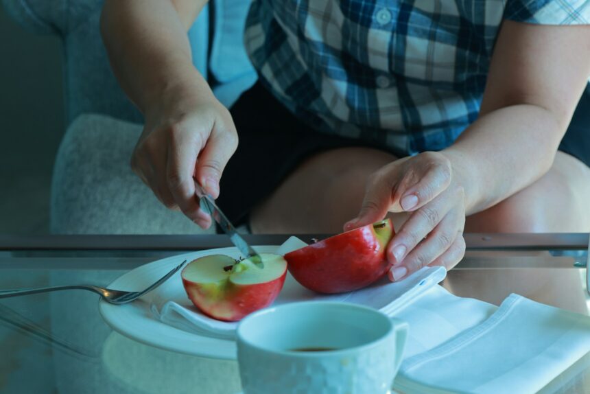 a person cutting a fruit