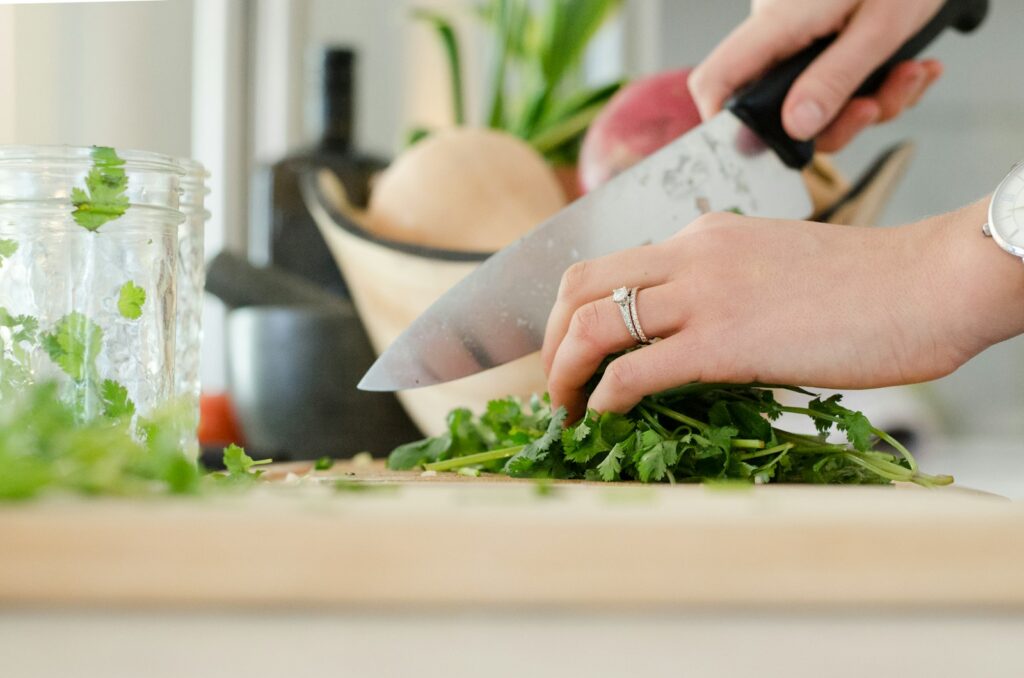 person cutting vegetables with knife Papa's Bakeria