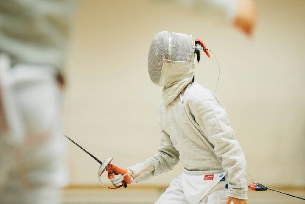 person holding black sabre dagger Competing in Tournaments Evowars