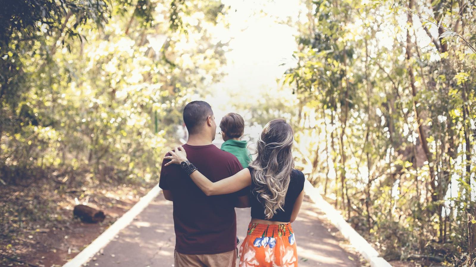 Photo of Family Walking on Park