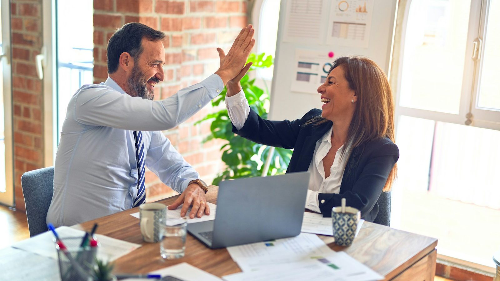 man in white dress shirt sitting beside woman in black long sleeve shirt. 6 Powerful Communication Tips for Happier Relationships