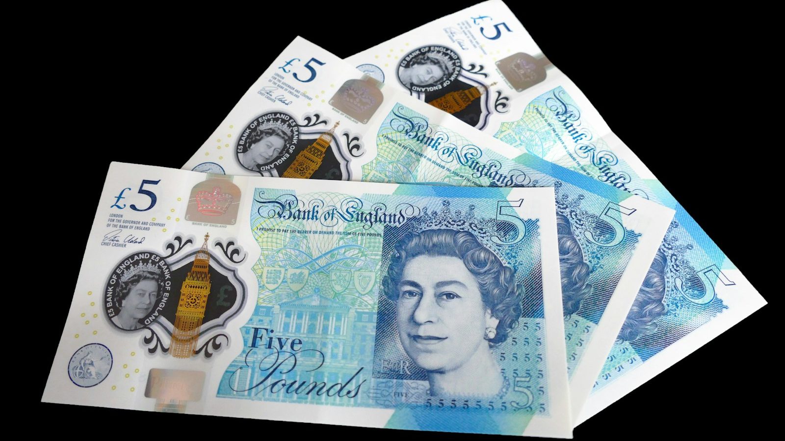 a pile of five different british pound notes. 10 Powerful Ways to Teach Your Kids About Money