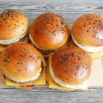 three burger on white ceramic plate