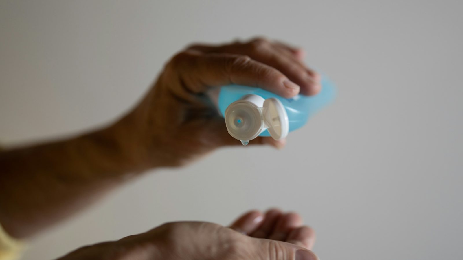 person holding white round ornament