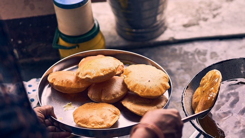 person cooking on black pan