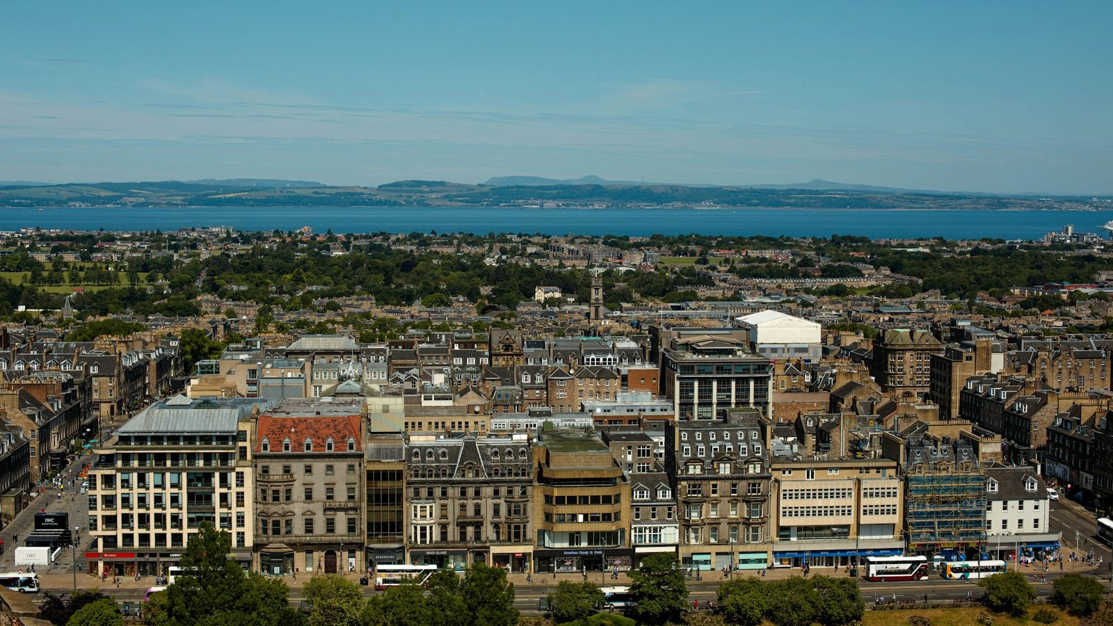 a view of a city with a body of water in the distance