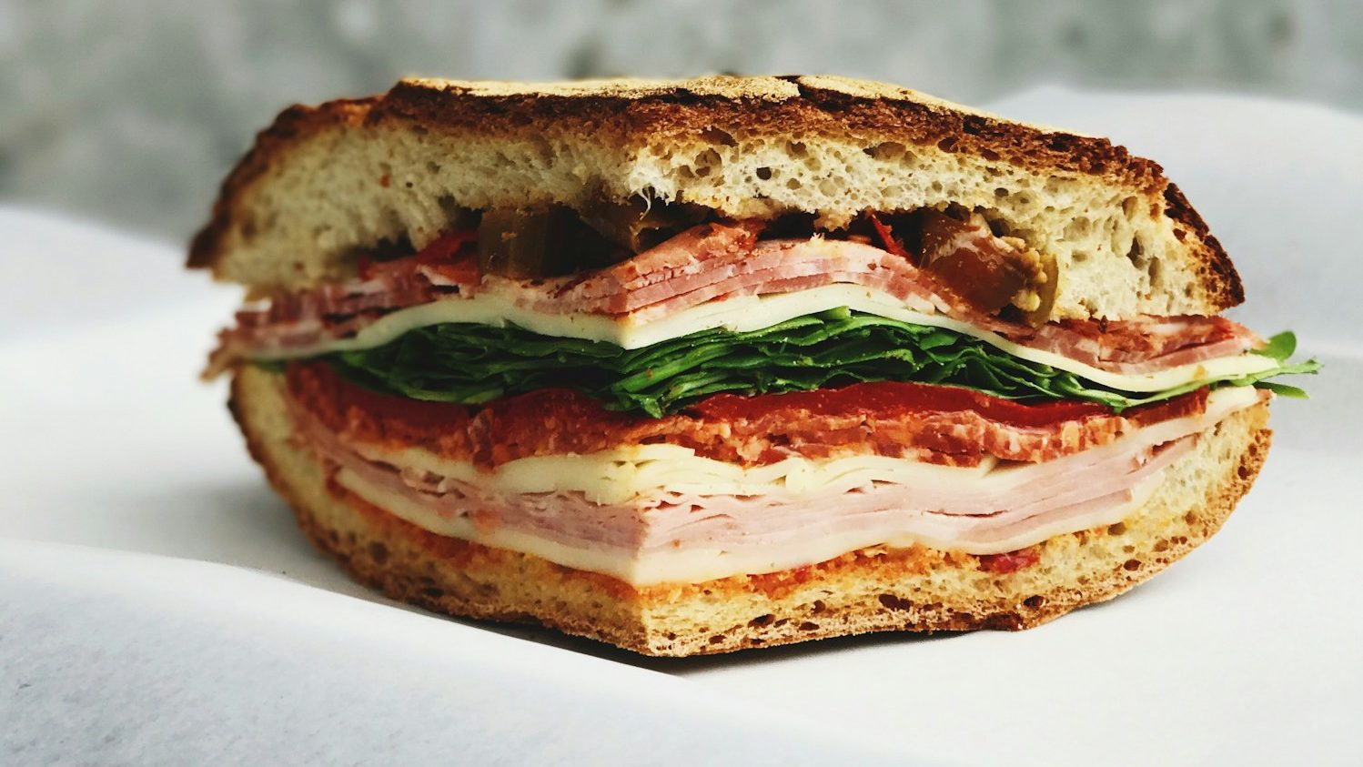 ham sandwich on white surface. 5 Worst Fast Foods You Should Never Eat Again