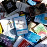 a pile of books sitting next to each other