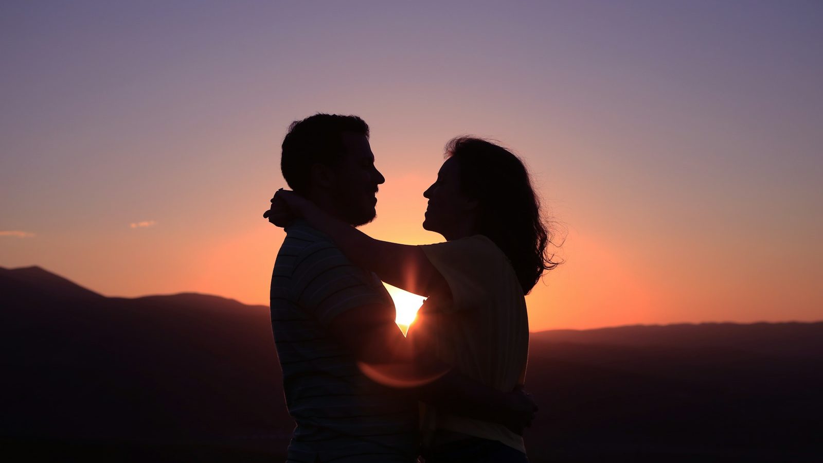 silhouette of hugging couple. 10 Signs You’re in a Toxic Relationship